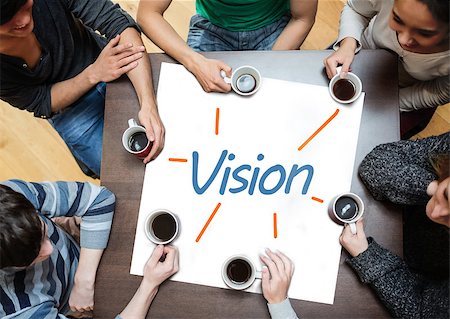 Team brainstorming over a poster on a table with vision written on it Stock Photo - Budget Royalty-Free & Subscription, Code: 400-06886057