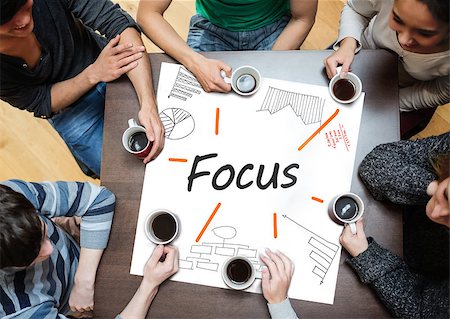 Focus written on a poster with drawings of charts during a brainstorm Stock Photo - Budget Royalty-Free & Subscription, Code: 400-06886062