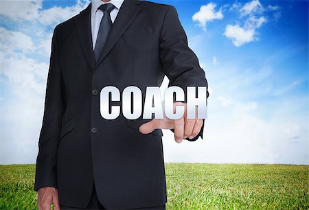 simsearch:400-06886821,k - Businessman selecting coach word with landscape on the background Photographie de stock - Aubaine LD & Abonnement, Code: 400-06886749