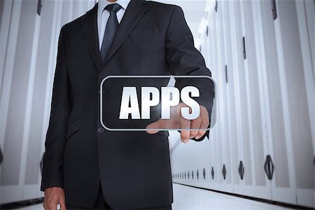 simsearch:400-06890460,k - Businessman in a data center selecting label with apps written on it Stock Photo - Budget Royalty-Free & Subscription, Code: 400-06886760