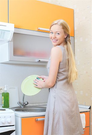 beautiful blond girl washing dishes at kitchen Stock Photo - Budget Royalty-Free & Subscription, Code: 400-06886930