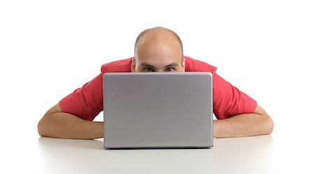 young man sitting at his desk with laptop isolated on white Stock Photo - Budget Royalty-Free & Subscription, Code: 400-06887081