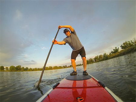 simsearch:400-07795226,k - mature male paddler enjoying workout on stand up paddleboard (SUP), calm lake in Colorado, summer Foto de stock - Royalty-Free Super Valor e Assinatura, Número: 400-06887294