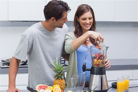 Couple putting various fruits into blender Stock Photo - Budget Royalty-Free & Subscription, Code: 400-06888363