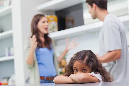 Sad girl listening to her parents arguing in the kitchen Stock Photo - Budget Royalty-Free & Subscription, Code: 400-06888387