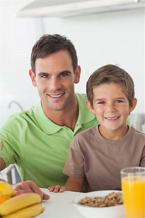 simsearch:400-06871178,k - Portrait of father and son during breakfast in the kitchen Stock Photo - Budget Royalty-Free & Subscription, Code: 400-06888457