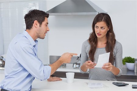 Couple doing their accounts in the kitchen Stock Photo - Budget Royalty-Free & Subscription, Code: 400-06888601
