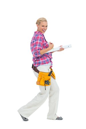 Blonde woman standing while playing with a spirit level on white background Stock Photo - Budget Royalty-Free & Subscription, Code: 400-06888878