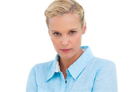 Angry blonde looking at camera on white background Stock Photo - Budget Royalty-Free & Subscription, Code: 400-06888960