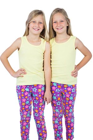 Sisters posing for the camera on a white background Stock Photo - Budget Royalty-Free & Subscription, Code: 400-06889013