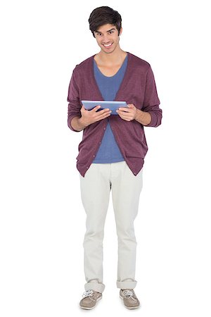 simsearch:400-06889148,k - Smiling man with tablet pc looking at the camera Foto de stock - Super Valor sin royalties y Suscripción, Código: 400-06889055