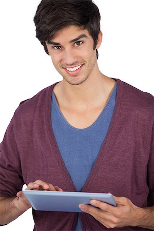 simsearch:400-06889355,k - Smiling young man using tablet pc on a white background Stockbilder - Microstock & Abonnement, Bildnummer: 400-06889052