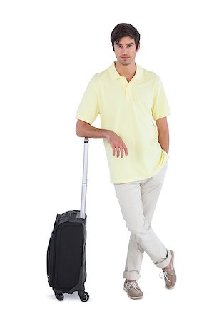 simsearch:400-06889146,k - Calm man standing with his suitcase on a white background Foto de stock - Super Valor sin royalties y Suscripción, Código: 400-06889162