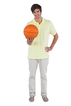 simsearch:400-06889148,k - Smiling man holding a basket ball on a white background Foto de stock - Super Valor sin royalties y Suscripción, Código: 400-06889171