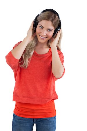 simsearch:400-06690896,k - Smiling woman listening to music on a white background Stock Photo - Budget Royalty-Free & Subscription, Code: 400-06889286