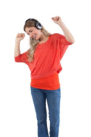 simsearch:400-06690896,k - Smiling woman listening to music with headphones on a white background Stock Photo - Budget Royalty-Free & Subscription, Code: 400-06889288