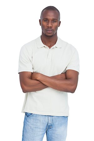 simsearch:400-06889355,k - Unsmiling man with arms crossed on a white background Stockbilder - Microstock & Abonnement, Bildnummer: 400-06889346