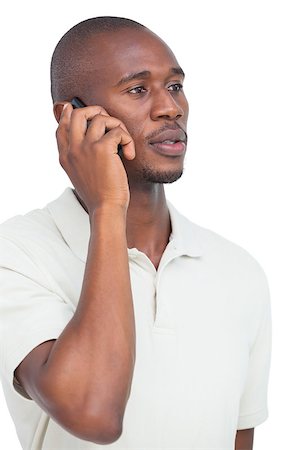 simsearch:400-06889355,k - Serious man on the phone on a white background Stockbilder - Microstock & Abonnement, Bildnummer: 400-06889363