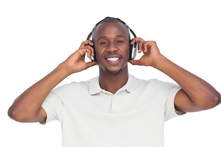 simsearch:400-06889355,k - Happy man listening music with headphones on a white background Stockbilder - Microstock & Abonnement, Bildnummer: 400-06889372