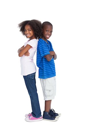 Brother and sister back to back looking at the camera Stock Photo - Budget Royalty-Free & Subscription, Code: 400-06889389