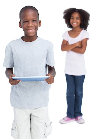 simsearch:400-06889355,k - Boy using tablet pc with his sister on a white background Stockbilder - Microstock & Abonnement, Bildnummer: 400-06889397