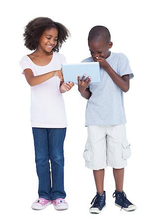 simsearch:400-06889355,k - Laughing boy looking at tablet pc with his sister Stockbilder - Microstock & Abonnement, Bildnummer: 400-06889391