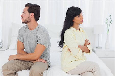 Couple sulking with arms crossed in bedroom Stock Photo - Budget Royalty-Free & Subscription, Code: 400-06889721