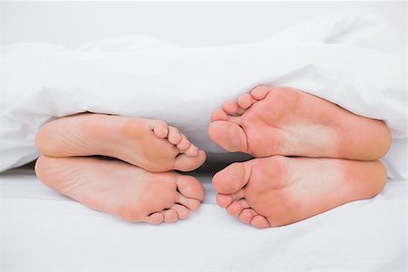 romantic pictures of lovers sleeping - Feet of a couple sleeping face to face in bed Stock Photo - Budget Royalty-Free & Subscription, Code: 400-06889902