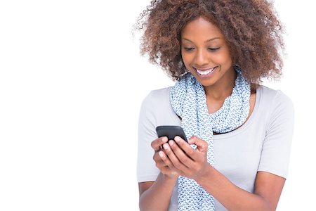 scarf curly woman - Cheerful woman typing a text message on her smartphone on white background Stock Photo - Budget Royalty-Free & Subscription, Code: 400-06880024