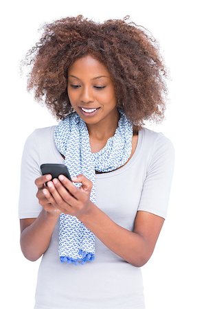 scarf curly woman - Smiling woman typing a text message on her smartphone on white background Stock Photo - Budget Royalty-Free & Subscription, Code: 400-06880025