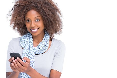 scarf curly woman - Cheerful woman typing a text message on white background Stock Photo - Budget Royalty-Free & Subscription, Code: 400-06880027