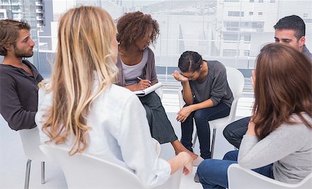 Group therapy session with one woman crying in therapists office Stock Photo - Budget Royalty-Free & Subscription, Code: 400-06880241