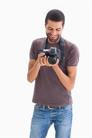 Stylish man with camera around his neck on white background Stock Photo - Budget Royalty-Free & Subscription, Code: 400-06880480