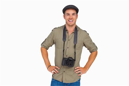 Happy man in peaked cap with camera around his neck on white background Stock Photo - Budget Royalty-Free & Subscription, Code: 400-06880606