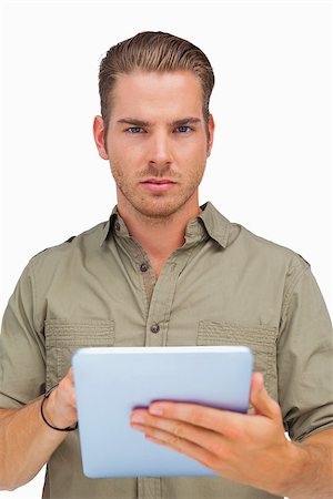 simsearch:400-06889355,k - Serious man using tablet pc on white background Stockbilder - Microstock & Abonnement, Bildnummer: 400-06880615