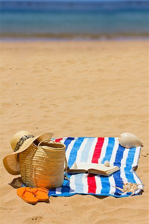 fashion accessories photos beach - towel and sunbathing accessories on  beach by sea Stock Photo - Budget Royalty-Free & Subscription, Code: 400-06880834