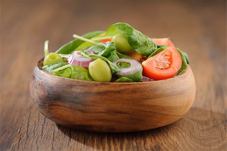 eating olive - Salad with tomato, olives and spinach Stock Photo - Budget Royalty-Free & Subscription, Code: 400-06881014