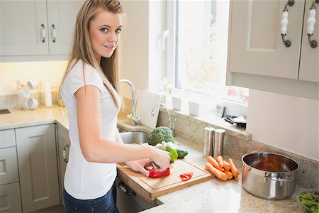 person chopping carrots - Woman preparing vegetables in kitchen Stock Photo - Budget Royalty-Free & Subscription, Code: 400-06881711