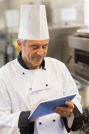 simsearch:400-07468062,k - Chef touching his digital tablet in the kitchen Stockbilder - Microstock & Abonnement, Bildnummer: 400-06882095