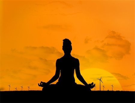 Silhouette of woman doing yoga in front of wind turbines and sunset Stock Photo - Budget Royalty-Free & Subscription, Code: 400-06882344