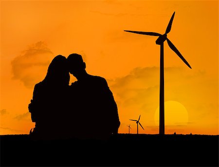 female silhouette in the wind - Couple embracing in front of a sunset with silhouettes of wind turbines Stock Photo - Budget Royalty-Free & Subscription, Code: 400-06882341