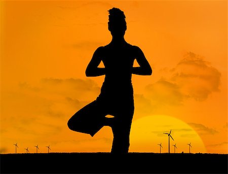 female silhouette in the wind - Silhouette of woman doing yoga outdoors in front of sunset and wind turbines Stock Photo - Budget Royalty-Free & Subscription, Code: 400-06882342