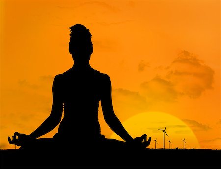 Silhouette of woman doing yoga in front of the sunset and wind turbines Photographie de stock - Aubaine LD & Abonnement, Code: 400-06882343