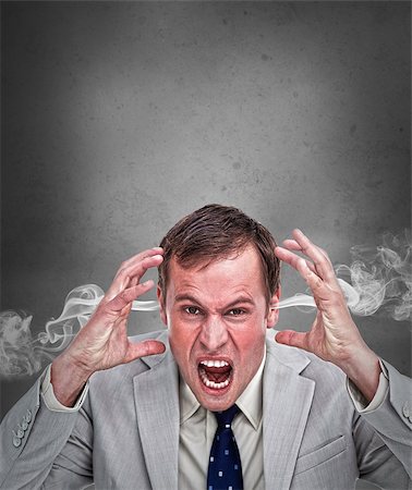 simsearch:400-06876781,k - Hot headed business man shouting on grey background with copy space Foto de stock - Royalty-Free Super Valor e Assinatura, Número: 400-06882371