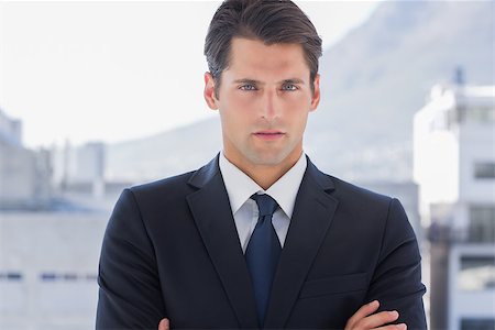 simsearch:400-07275251,k - Businessman standing with arms crossed in a bright office Stock Photo - Budget Royalty-Free & Subscription, Code: 400-06882778