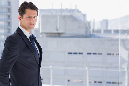 simsearch:400-07275251,k - Handsome confident businessman standing in his office Stock Photo - Budget Royalty-Free & Subscription, Code: 400-06882781