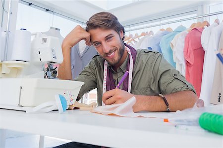 simsearch:400-06885526,k - Happy designer working at his desk in a bright creative office Stock Photo - Budget Royalty-Free & Subscription, Code: 400-06883167