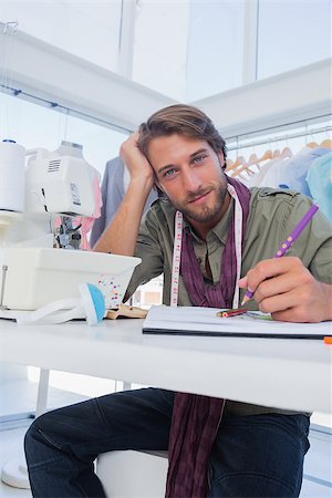 simsearch:400-06885526,k - Attractive fashion designer working at his desk in a bright creative office Stock Photo - Budget Royalty-Free & Subscription, Code: 400-06883168