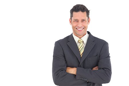 simsearch:400-07274414,k - Smiling handsome businessman with crossed arms on white background Photographie de stock - Aubaine LD & Abonnement, Code: 400-06883328