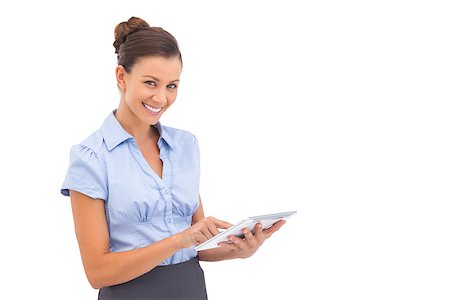 Smiling businesswoman with digital tablet looking at the camera Stock Photo - Budget Royalty-Free & Subscription, Code: 400-06883440